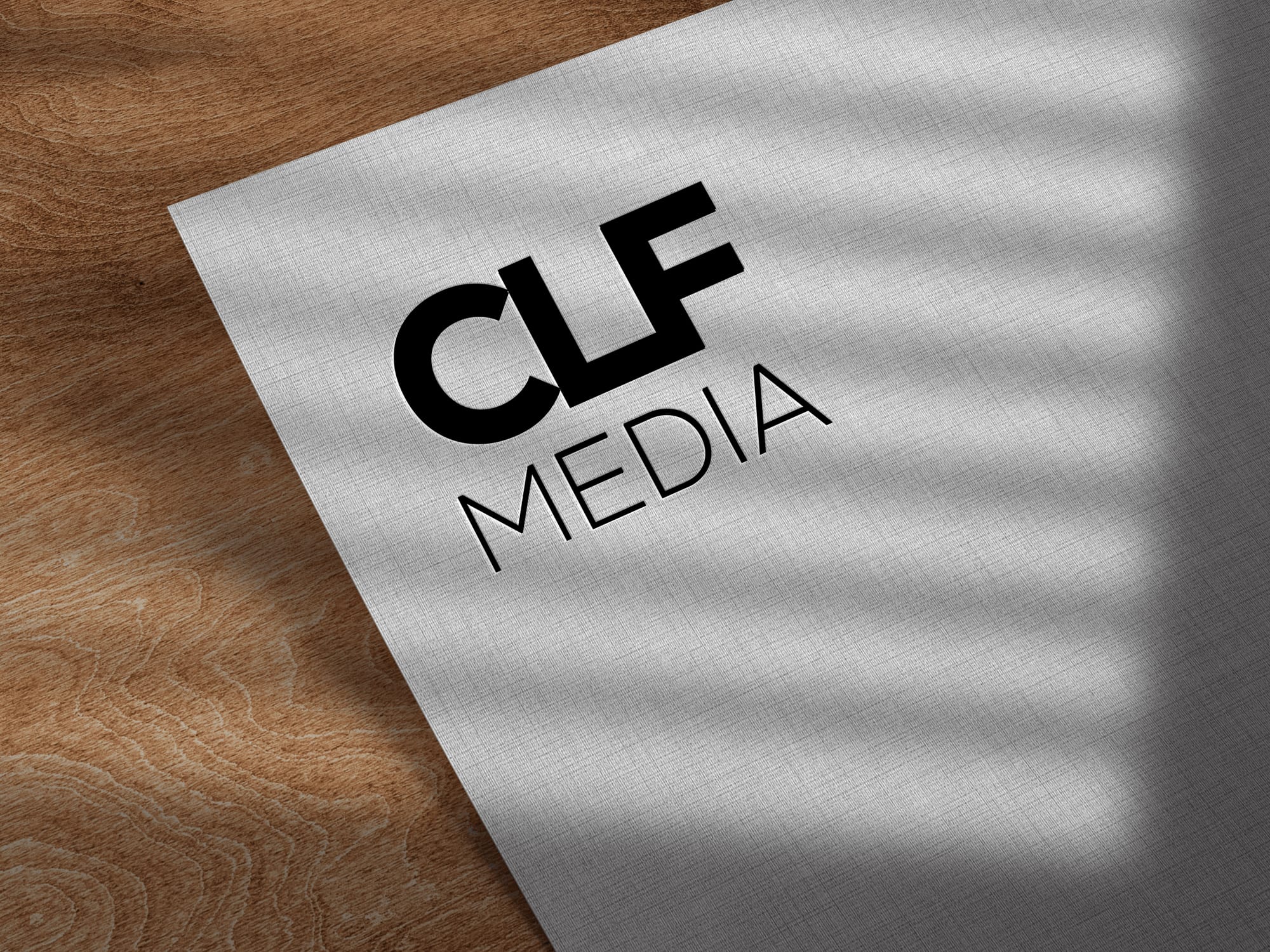 Clf Medias logotyp tryckt på papper i en mockup